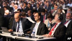 Delegates attend the opening ceremony of the Climate Change Conference in Lima, Peru, Dec. 1, 2014.