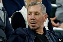 FILE - Larry Ellison, chairman of Oracle Corporation and chief technology officer, watches from the stands at the BNP Paribas Open tennis tournament October 13, 2021, in Indian Wells, Calif.