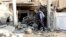 An Iraqi policeman inspects the site of a bomb attack in Kirkuk, 250 km (155 miles) north of Baghdad, Nov. 5, 2013. 