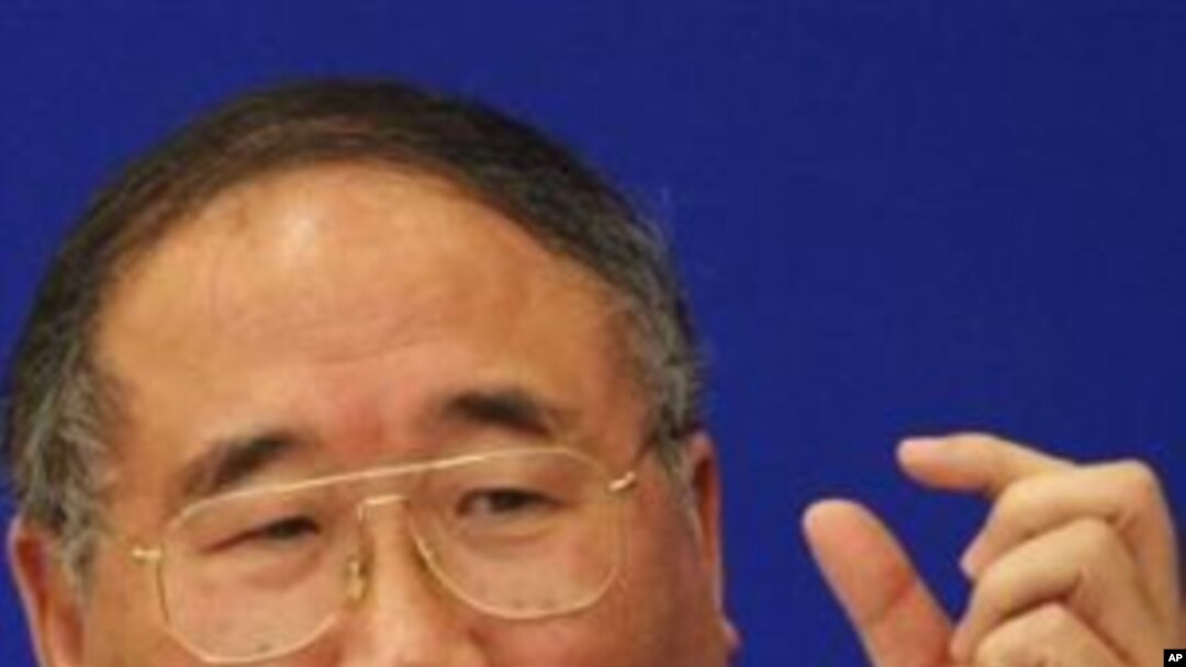 China's top climate change negotiator, Xie Zhenhua, gestures as he answers a question during a press conference, inside the Great Hall of the People in Beijing (File Photo)