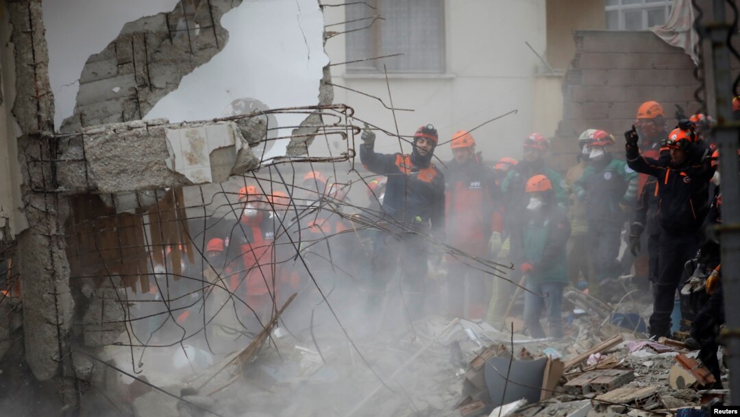 Rescue workers are seen at the site of a collapsed residential building in the Kartal district of Istanbul, Turkey, Feb. 7, 2019.