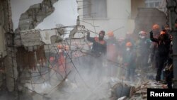 Rescue workers are seen at the site of a collapsed residential building in the Kartal district of Istanbul, Turkey, Feb. 7, 2019.