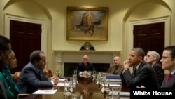 An employee of ActiveLink Co. established under the sponsorship of Panasonic Corp, demonstrates ARM01, called &#39;Raku Vest&#39;, jointly developed with Kubota Corp., in Tokyo, Japan. The ARM01 is a robotic exoskeleton developed to help farmers and construction workers.