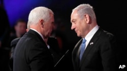 U.S. Vice President Mike Pence and Israeli Prime Minister Benjamin Netanyahu greet each other at the World Holocaust Forum in Jerusalem on Jan. 23, 2020. 