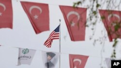 Turkish flags and banners depicting Mustafa Kemal Ataturk, the founder of modern Turkey, decorate a street outside the United States Embassy in Ankara, Turkey, Apr. 25, 2021. 