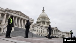 U.S. Capitol Police stand guard on a plaza surrounding the Capitol before Congress meets to certify the electoral college vote for President-elect Joe Biden in Washington, Jan. 6, 2021. 