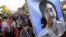 FILE - Marchers carry a large painting of jailed American Indian Leonard Peltier during a march for the National Day of Mourning in Plymouth, Mass, Nov. 22, 2001. United American Indians of New England held its first National Day of Mourning in 1970.