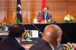 FILE - Nasser Bourita, Morocco's Minister of Foreign Affairs and International Cooperation, chairs a meeting of representatives of Libya's rival administrations in the coastal town of Bouznika, south of Rabat, Sept. 6, 2020.