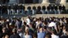 Serbia, Belgrade, Police officers stand guard as demonstrators gather during an anti-government rally, amid the spread of the coronavirus disease 