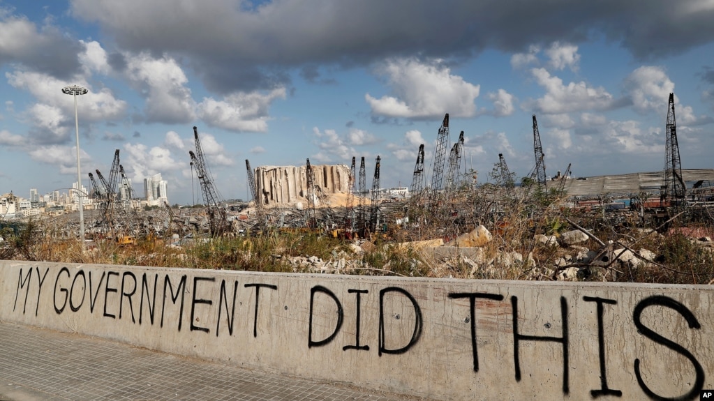 Words are written by Lebanese citizens in front of the scene of Tuesday's explosion that hit the seaport of Beirut, Lebanon, Sunday, Aug. 9, 2020. Public fury over the massive explosion in Beirut took a new turn Saturday night as protesters stormed…