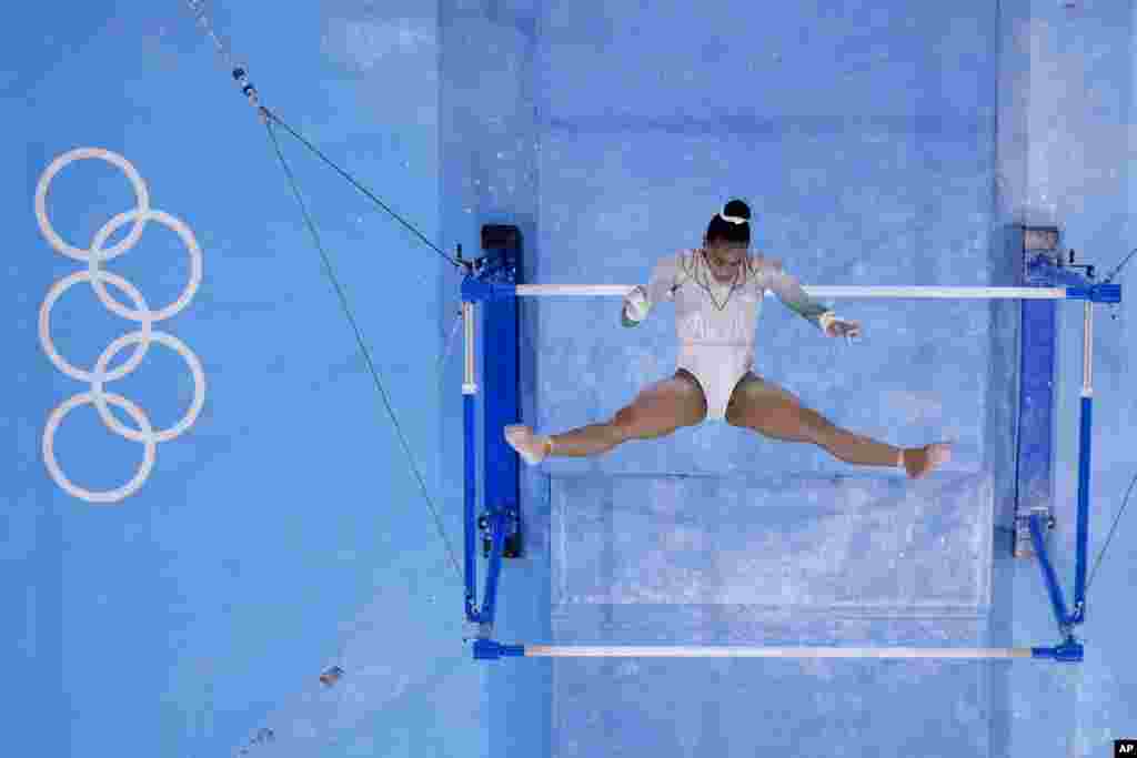 Caitlin Rooskrantz, of South Africa, performs on the uneven bars during women&#39;s artistic gymnastic qualifications at the 2020 Summer Olympics, Sunday, July 25, 2021, in Tokyo. (AP Photo/Morry Gash)