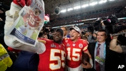 Kansas City Chiefs' Frank Clark, left, and Patrick Mahomes celebrate after defeating the San Francisco 49ers in the NFL Super Bowl 54 football game Sunday, Feb. 2, 2020, in Miami Gardens, Fla. (AP Photo/David J. Phillip)