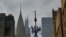 Flags of the UN and USA fly outside the United Nations headquarters ahead of the 78th session of the United Nations General Assembly in New York City on September 15, 2023.