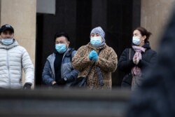 People wearing face masks to help curb the spread of the coronavirus leave a subway in Moscow, Russia, Oct. 26, 2020. Russia's caseload remains the fourth largest in the world.