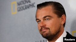 Leonardo DiCaprio berpose sebelum penayangan film dokumenternya di Markas Besar PBB di New York (20/10). (Reuters/Brendan McDermid)