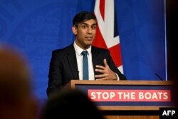 FILE - Britain's Prime Minister Rishi Sunak reacts at a press conference at Downing Street, in central London, Nov. 15, 2023.