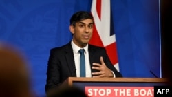 Britain's Prime Minister Rishi Sunak reacts as he gives a press conference, following the Supreme Court's Rwanda policy judgement, at Downing Street, in central London, Nov. 15, 2023.