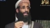 FILE - Anwar al-Awlaki, a U.S.-born cleric linked to al-Qaida's Yemen-based wing, gives a religious lecture in this still image taken from video. A terrorism suspect behind bars for allegedly helping al-Awlaki was indicted for ordering a hit on federal judge.