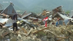 Flags Mark Sites of Trapped Bodies in Indonesia Quake