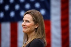 Judge Amy Coney Barrett reacts as President Donald Trump announces her as his nominee to fill a vacant Supreme Court seat, at the White House in Washington, Sept. 26, 2020.