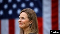 Judge Amy Coney Barrett reacts as President Donald Trump announces her as his nominee to fill a vacant Supreme Court seat, at the White House in Washington, Sept. 26, 2020.