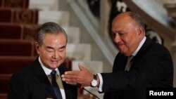 FILE - Egyptian Foreign Minister Sameh Shoukry and Chinese Foreign Minister Wang Yi hold a press conference, in Cairo, Egypt January 14, 2024. 