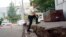 A man walks over ground that shifted in an earthquake in Kiyota, on the outskirts of Sapporo, Hokkaido, northern Japan, Sept. 7, 2018. 
