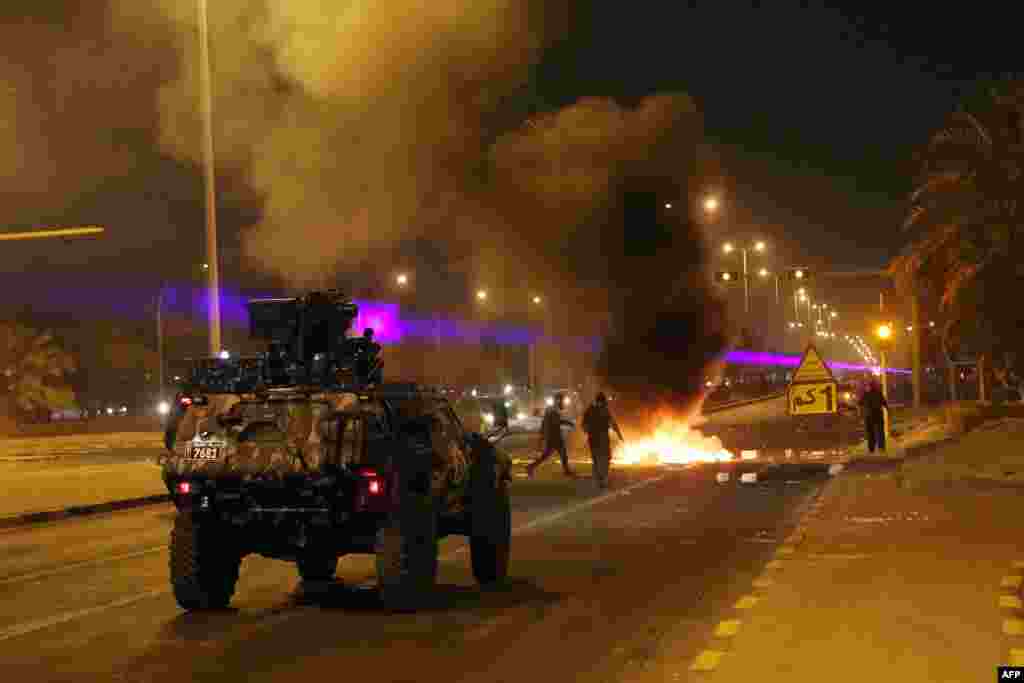 Kuwaiti security forces arrive at the scene during a demonstration of supporters of opposition leader and former MP Mussallam al-Barrak to demand his release in Kuwait City. Barrak is held in custody for alleged slander and insults to the supreme judicial council.