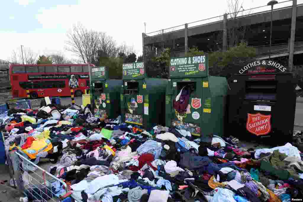 Clothing-donation containers are overstocked can be seen as the coronavirus pandemic continues, in London.