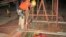 This Oct. 17, 2018, photo provided by the Maricopa County Sheriff's Office shows rescue team members lowering themselves into an abandoned mine shaft to rescue a man who had fallen into the shaft two days earlier, near Aguila, Ariz.