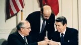 FILE - U.S. President Ronald Reagan (R) and Soviet leader Mikhail Gorbachev exchange pens during the Intermediate Range Nuclear Forces Treaty signing ceremony in the White House East Room in Washington, D.C., Dec. 8, 1987. 