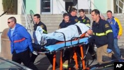 Paramedics transport student wounded during shooting Jan. 10, 2013 at San Joaquin Valley high school in Taft, Calif (Taft Midway Driller/Doug Keeler)