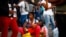 Migrants wait as they hope to receive help from the Mexican government to obtain humanitarian visas to transit Mexican territory, in Tapachula, Mexico, Dec. 4, 2021. 