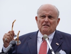 FILE - Rudy Giuliani, President Donald Trump's personal attorney, speaks in Portsmouth, New Hampshire, Aug. 1, 2018.