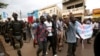 Opposition supporters hold up placards during a protest against what they say were irregularities in the first-round vote count, ahead of the second round, in Bamako, Mali, Aug. 11, 2018.