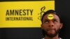 FILE - Human rights campaigner looks on during the release of an Amnesty International report in Abuja, Nigeria, May 16, 2017. 