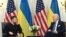 FILE - Ukrainian President Volodymyr Zelenskyy and U.S. President Joe Biden meet at the Intercontinental Hotel in Paris on June 7, 2024. The two leaders are expected to sign a defense and security agreement on June 13.