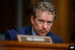 FILE - Republican Sen. Rand Paul pauses during a Senate committee hearing on Capitol Hill, March 5, 2019.