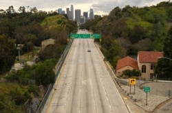 Hardly any cars move along the 110 Harbor Freeway toward downtown, in Los Angeles, California, March 20, 2020.