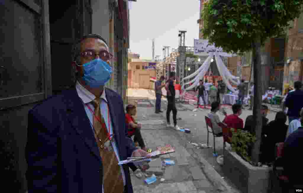 At the polls, lawyer Mostafa Hefny comments on what he expects to be a lackluster turn out of young voters, saying, “Most of them don&#39;t understand the role of the senate or how it will benefit them,” in Cairo, Aug. 11, 2020. 