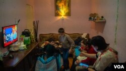 Nine children and three adults pack into this small apartment after fleeing violence in the disputed area of Nagorno-Karabakh last week. Pictured in Yerevan, Armenia on Oct. 6, 2020. (Yan Boechat/VOA)