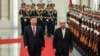 Chinese President Xi Jinping and Pakistani President Asif Ali Zardari walk past honor guards during the welcome ceremony at the Great Hall of the People in Beijing, China, Feb. 5, 2025.