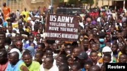 FILE - Nigeriens gather in a street to protest against the U.S. military presence, in Niamey, Niger April 13, 2024. 