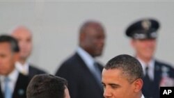 President Barack Obama talks with New Mexico Rep. Al Park, after arriving at Kirtland Air Force Base, N.M., 27 Sep 2010