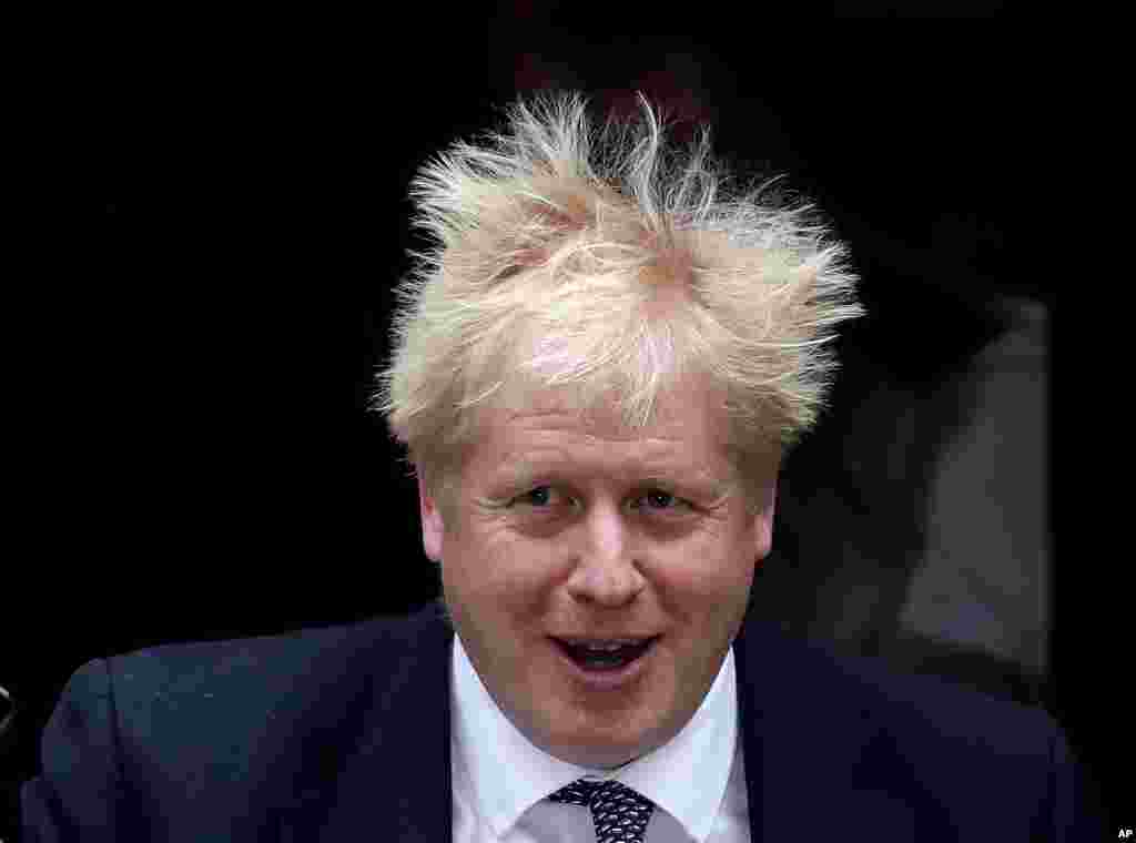 British Prime Minister Boris Johnson leaves 10 Downing Street to attend the weekly Prime Ministers&#39; Questions session, in parliament in London.