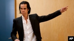 FILE - Australian musician Nick Cave poses during a photo call promoting his album 'Push the Sky Away' in Mexico City, Mexico, Feb. 18, 2013.