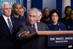 Dr. Anthony Fauci, director of the National Institute of Allergy and Infectious Diseases, with Vice President Mike Pence behind him, speaks during a briefing about the coronavirus in the James Brady Press Briefing Room of the White House, March 15, 2020,