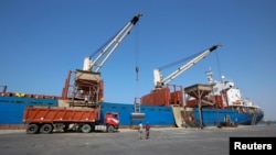 Workers unload aid shipment of wheat from St. George ship, at the Red Sea port of Hodeidah, Yemen, Nov. 30, 2017. “We cannot have war in Hodeidah," said Jan Egeland of the Norwegian Refugee Council.