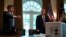Associate director of the NASA jet propulsion laboratory Dave Gallagher shows President Donald Trump a ventilator created by their engineers during a demonstration in the Cabinet Room of the White House, April 24, 2020, in Washington. 