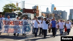 FILE - Teamsters union members march in the annual Labor Day Parade in Detroit, Michigan, on Sept. 2, 2024. The union announced on Sept. 18 that it would not endorse either of the major candidates for president in the U.S. election.